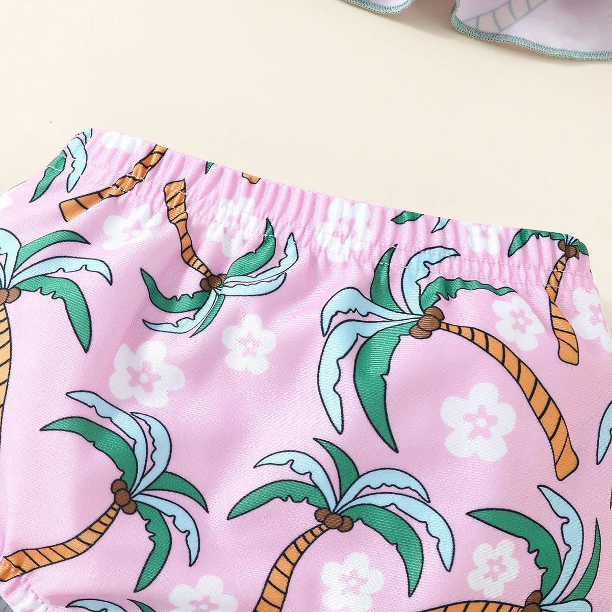 White children's two-piece swimsuit set with shirt and shorts for toddlers.