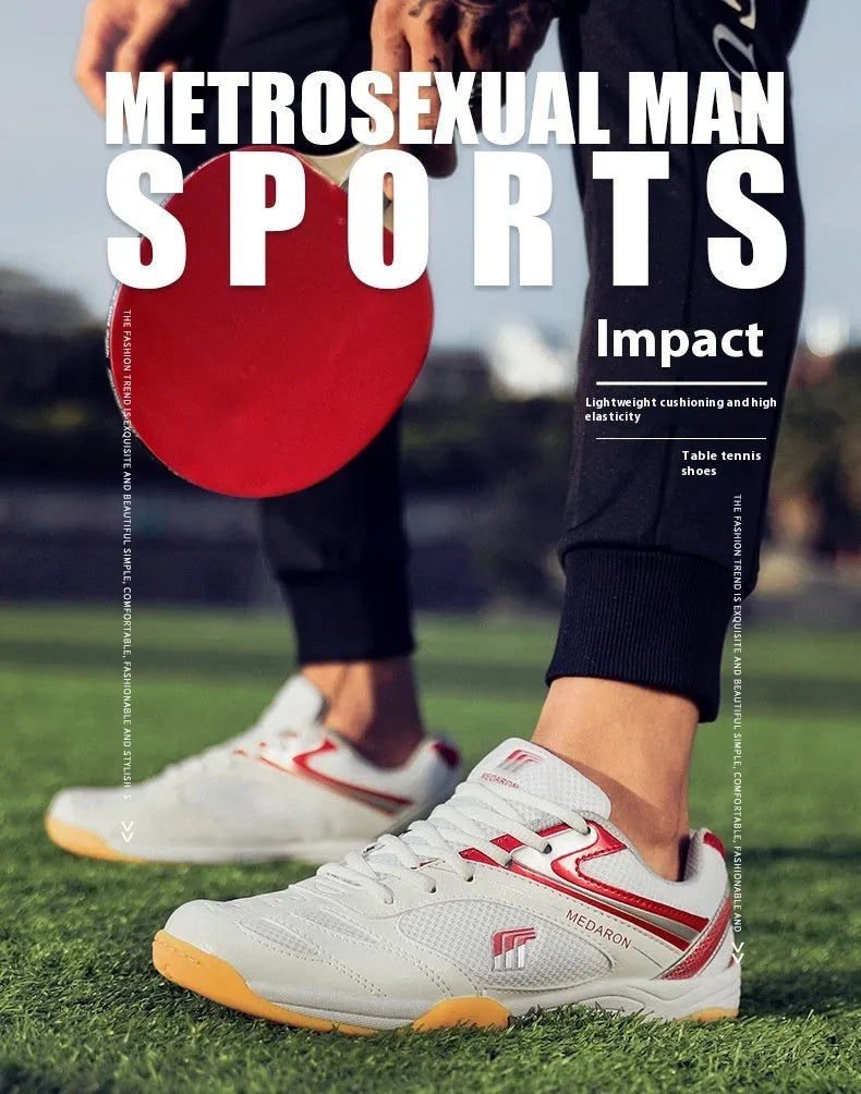 White and blue table tennis shoes with mesh panels and rubber sole on a court surface.