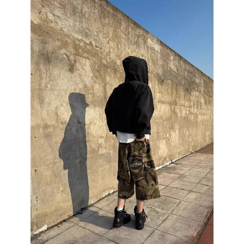 Men's loose-fit camouflage cropped jeans with ripped patches and straight leg