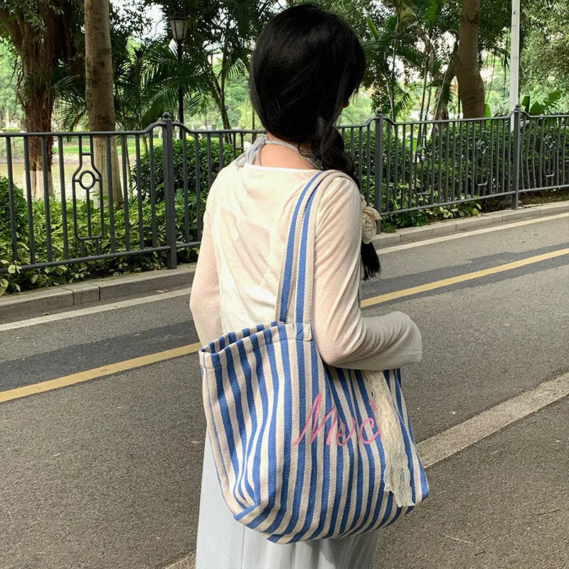 Blue and white striped cotton canvas bag with printed letters in a fresh, sweet style.