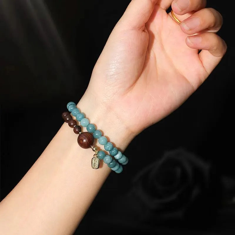 Women's blue gold sandalwood beaded bracelet with geometric design and Fu character, New Chinese style.