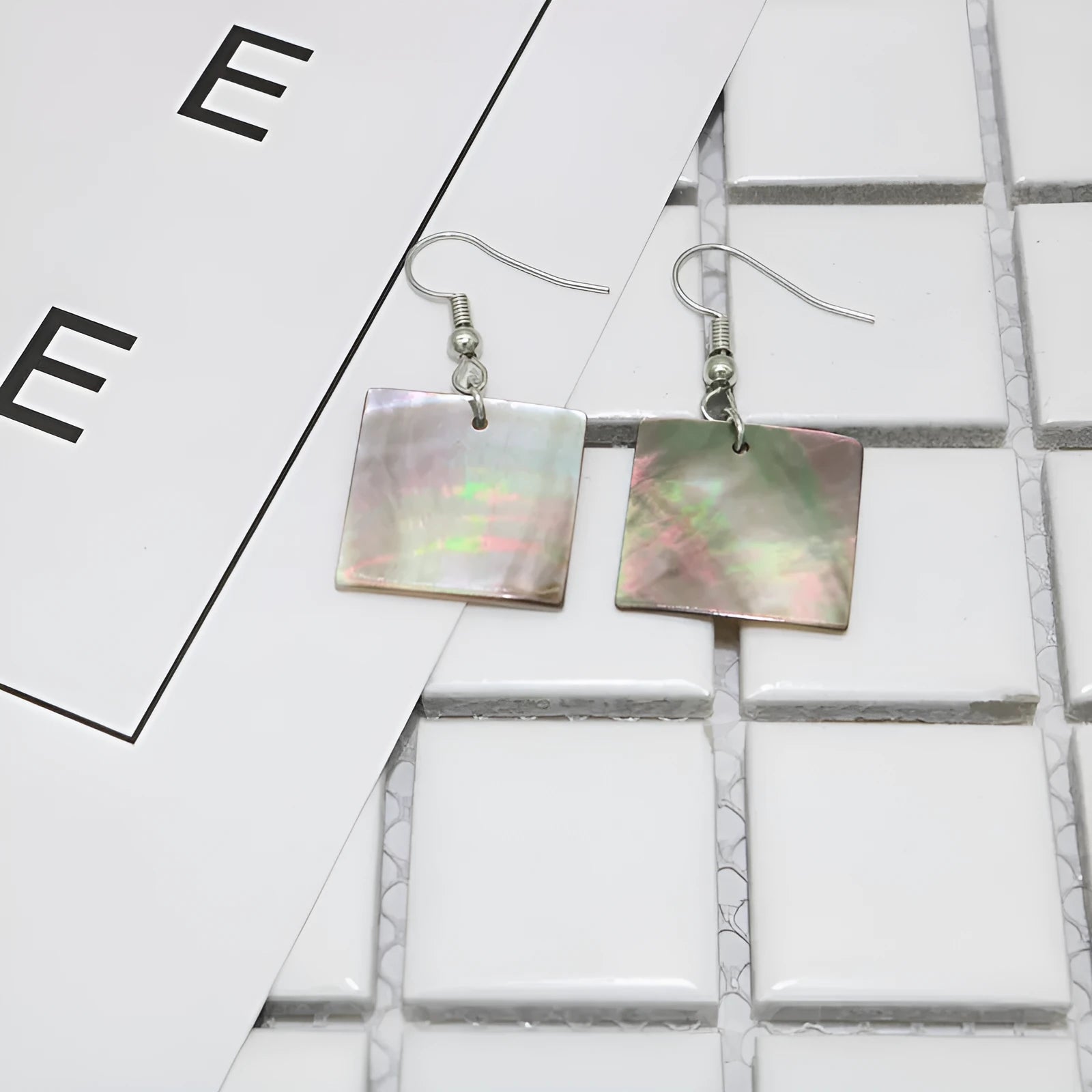 Geometric shell earrings with rectangular or square panther patterns, natural material, retro design