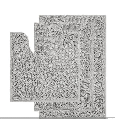 Dark green chenille U-shaped three-piece bathroom toilet carpet set on tiled floor.