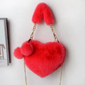 Women's soft plush heart-shaped handbag in medium size with adjustable shoulder strap