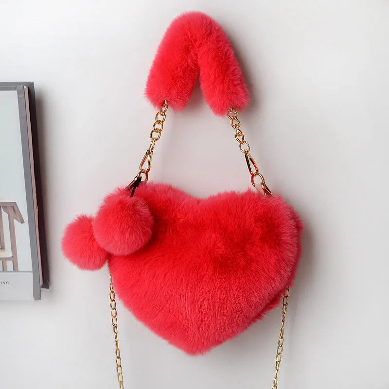 Women's soft plush heart-shaped handbag in medium size with adjustable shoulder strap