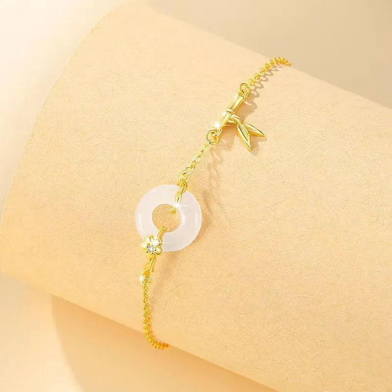 Women's silver bracelet with white chalcedony and starry sky design featuring peace buckle