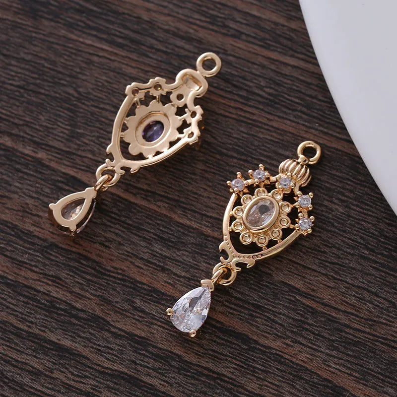 Small hollow water drop pendant with micro zircon detailing in five colour options measuring 12mm by 23mm