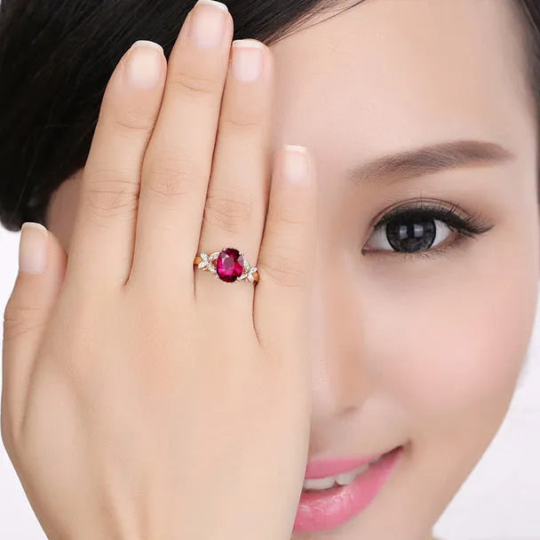 Women's copper butterfly ring with heart design in 18k rose gold tone, blue and red options