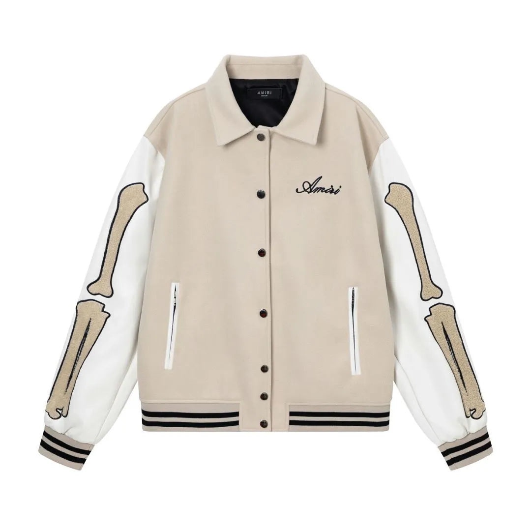 Women's apricot embroidered wool jacket with bone design detail on front.