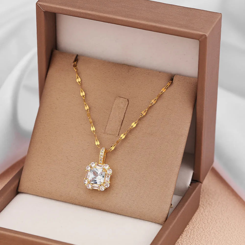 Gold geometric zircon clavicle necklace on titanium steel water wave chain.