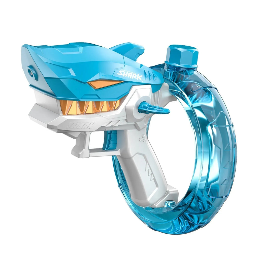 Blue Shark-shaped electric water gun toy with a large tank, placed on a sandy beach.