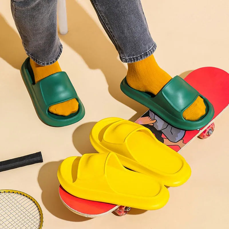 A pair of soft, thick-soled EVA flip-flop slippers in a chosen colour, showing the non-slip tread pattern on the sole.