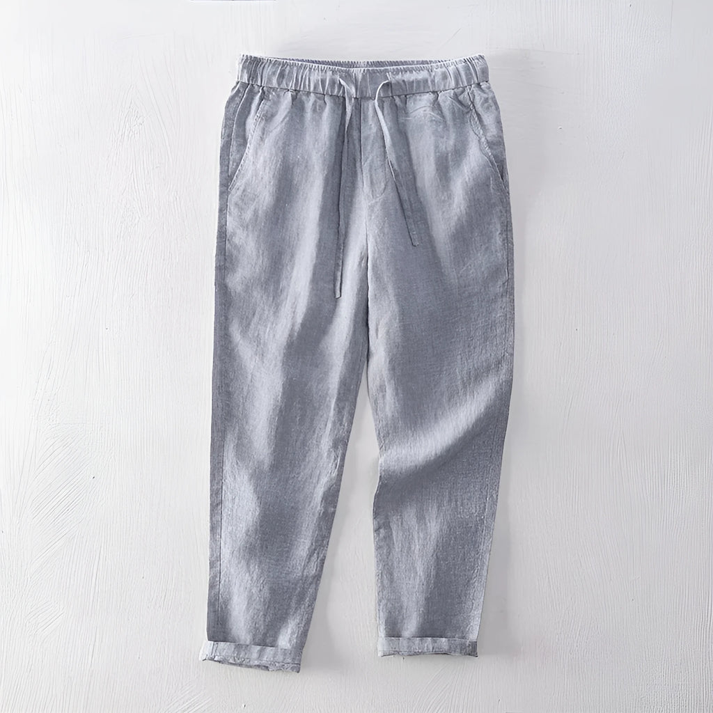 Men's linen straight leg trousers in light grey showing mid-waist design and straight cut