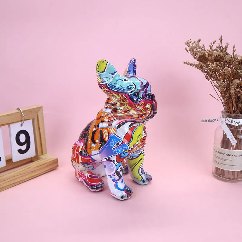 Graffiti coloured solid resin French Bulldog statue on a white background.