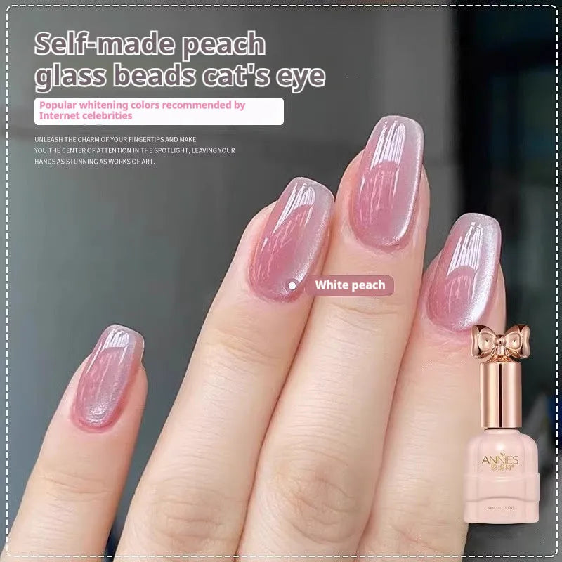 Bottle of micro glass bead cat's eye gel nail polish for magnetic nail art in various colours.