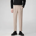 Man wearing straight leg grey suit pants for business casual attire.