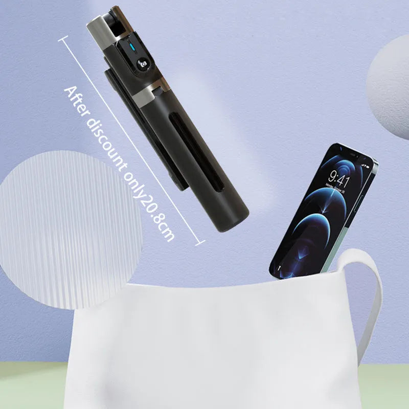 Black aluminium Bluetooth selfie stick with dual fill lights extended on a desktop.