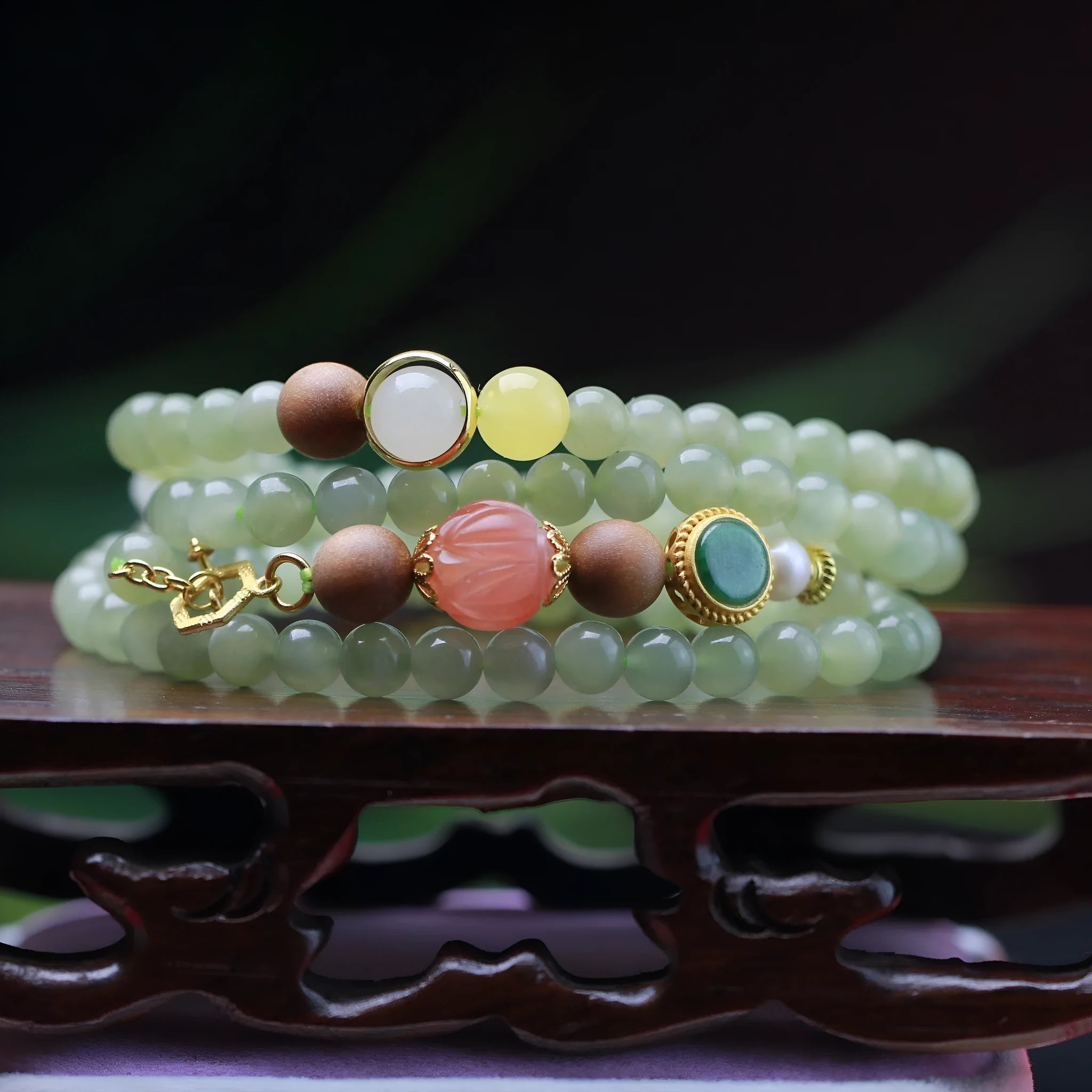 Hand-carved red Hetian Jade lotus bead necklace with white sandalwood beads, beeswax pendant, and zodiac charm.