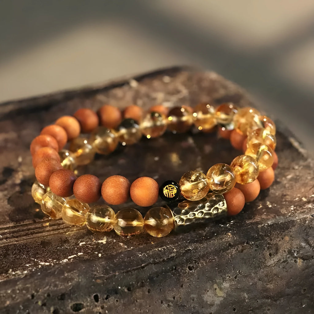 Handcrafted Barbie tan yellow tower crystal double ring bracelet on wrist.