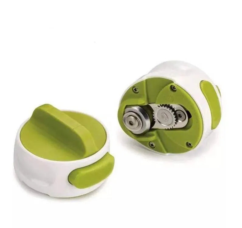 Green stainless steel bottle opener gadget for screw-top lids on a kitchen counter.
