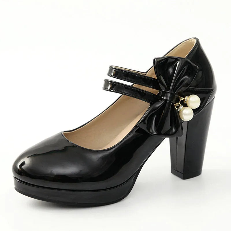Women's red chunky heel platform shoes with round toe and buckle fastening on a rubber sole.