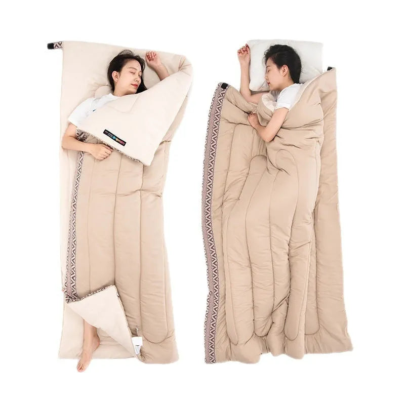 Portable outdoor sleeping bag in one of three colours, shown with its storage bag.