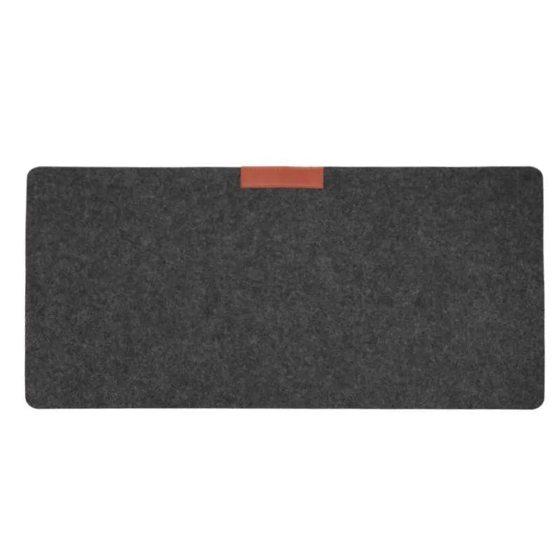 Large black felt desk mat with sewn edges, measuring 325x635mm, on an office desk with a keyboard and mouse.