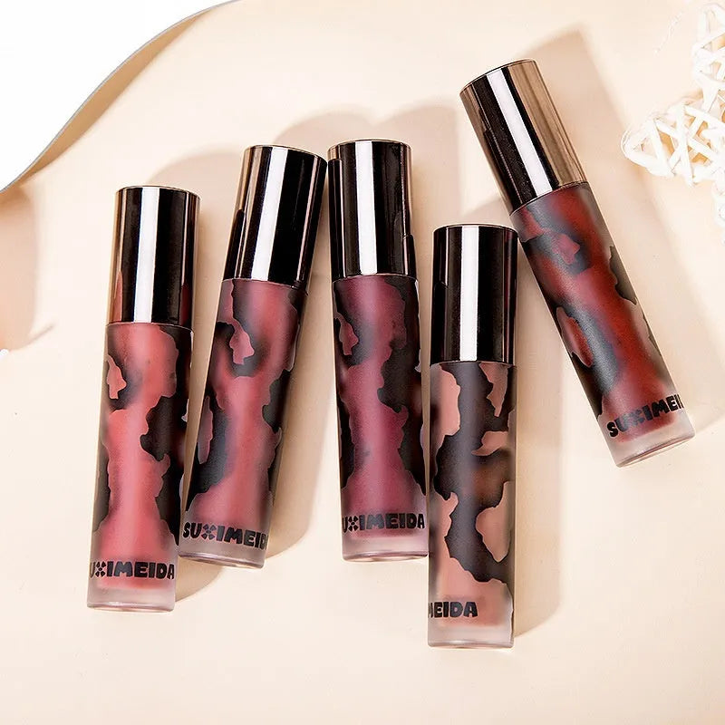 Matte lip mud lipstick tube in one of five shades: orange brown coffee, cool grey, cinnamon coffee, jujube red, or smoked purple.