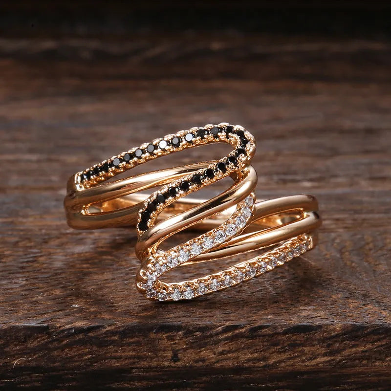 Fashion personality ring with micro-inlaid zircon detailing on copper with electroplated WK2230 finish.