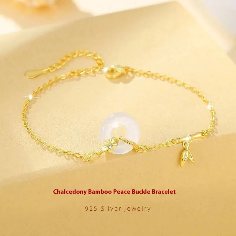Women's silver bracelet with white chalcedony and starry sky design featuring peace buckle