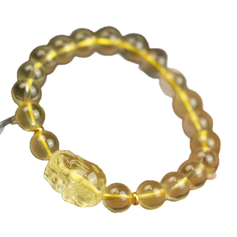 Simple yellow leather cord bracelet with a faceted citrine-coloured artificial crystal pi xiu bead.
