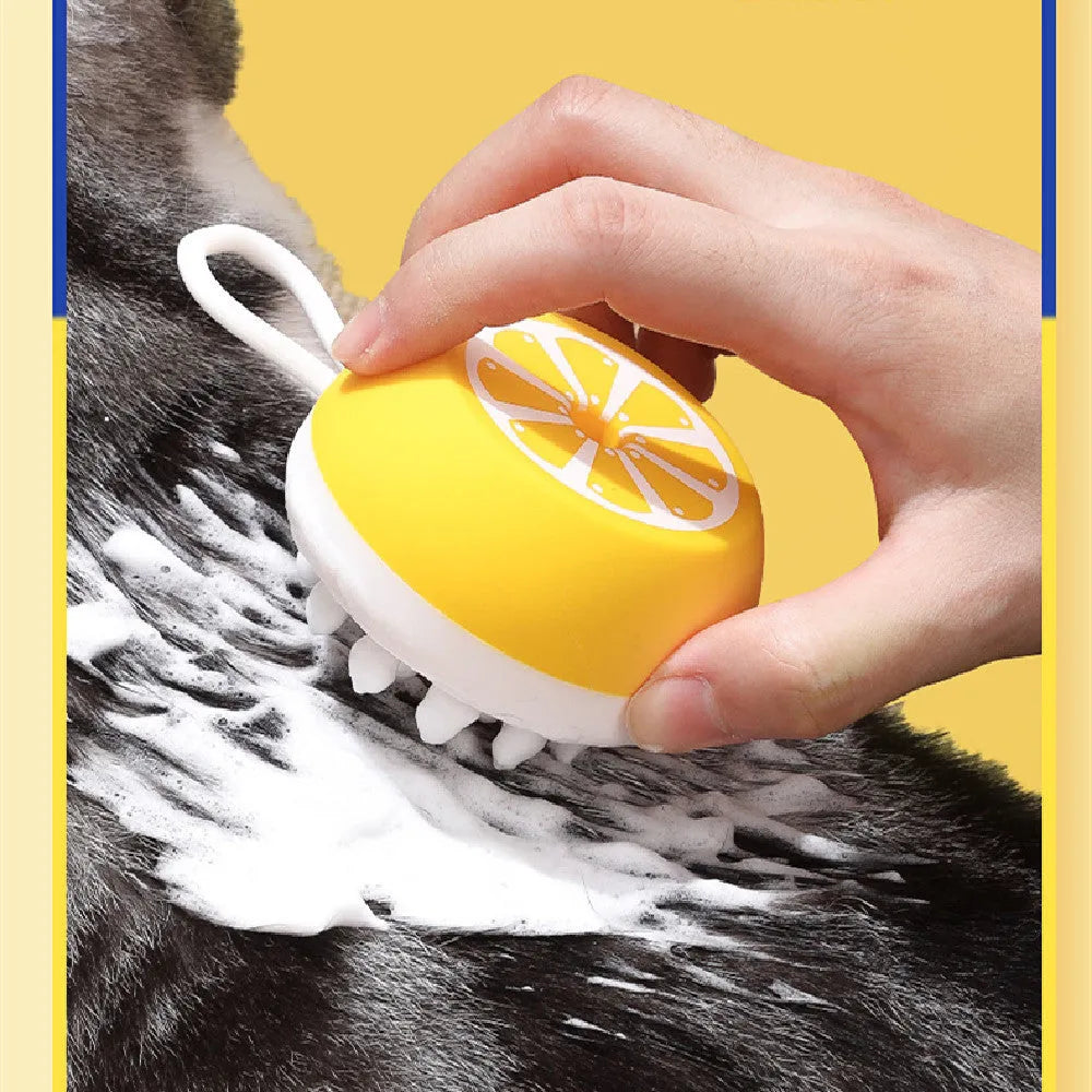 Yellow silicone pet bath brush with massage head design for dog and cat grooming during bathing