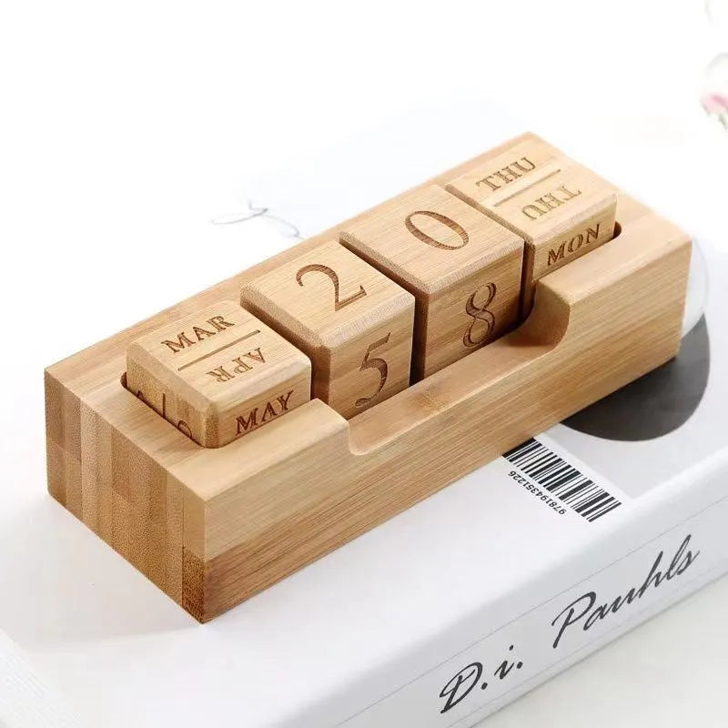 Solid wood creative simple desk calendar cube in large and small size options.