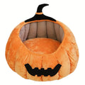Halloween pumpkin-shaped cat bed with cartoon devil design in soft plush material