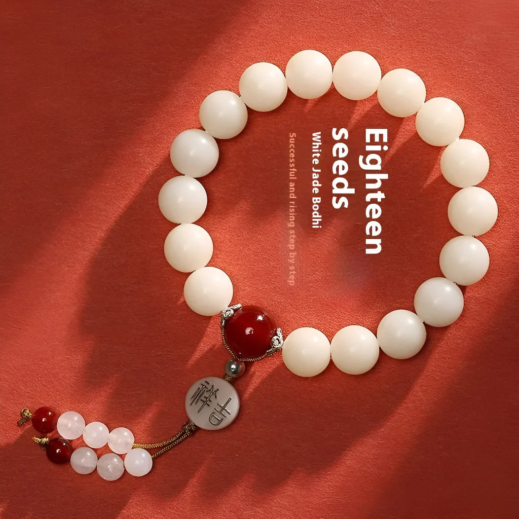 White jade Bodhi bracelet with round 10mm beads, ruyi decoration, shown in obsidian, red agate and red code brain colour variants