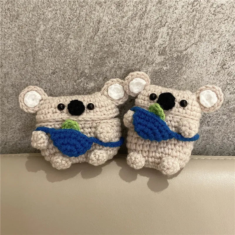 Handmade knitted grey koala bear backpack design cover on an Apple AirPods Pro charging case.