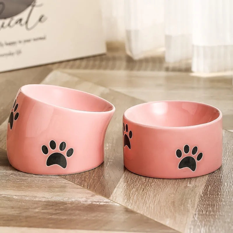 Ceramic cat bowl with high foot design and oblique mouth in cat's paw pattern