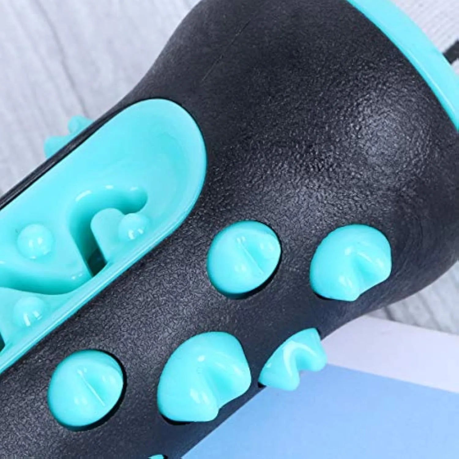 Natural rubber dog toothbrush chew toy in blue with cleaning bristles, shown next to a size scale.