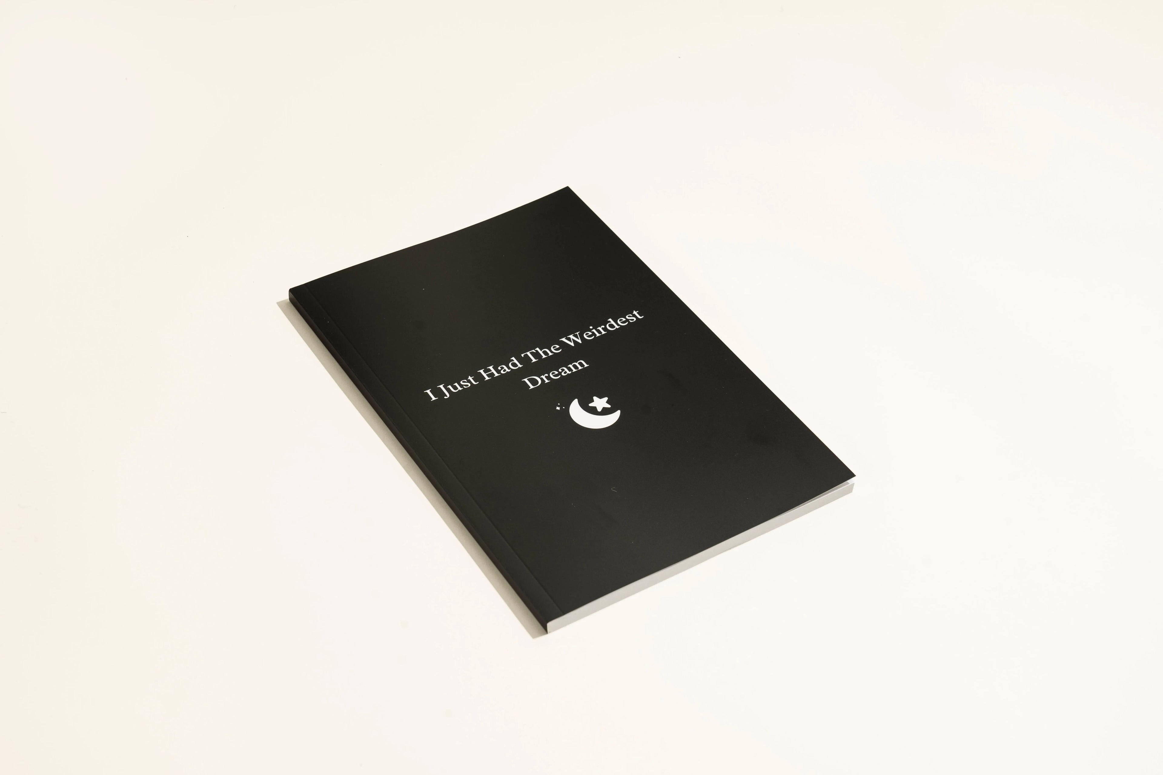 Black hardcover dream journal notebook with a business simplicity design.