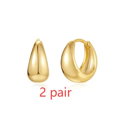 Gold tone brass diamond earclip earrings with geometric round shape and European styling