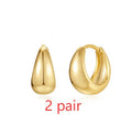 Gold tone brass diamond earclip earrings with geometric round shape and European styling