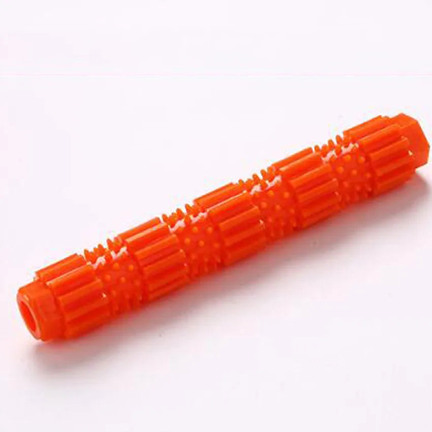 Green and orange rubber dog chew toy with treat dispensing hole and textured surface
