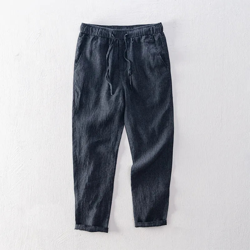 Men's linen straight leg trousers in light grey showing mid-waist design and straight cut