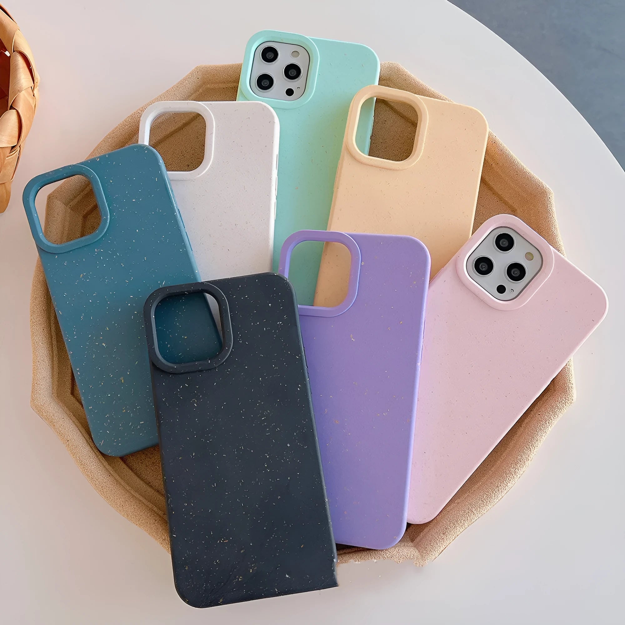 Wheat straw fibre degradable rear cover case for Apple iPhone on a table.