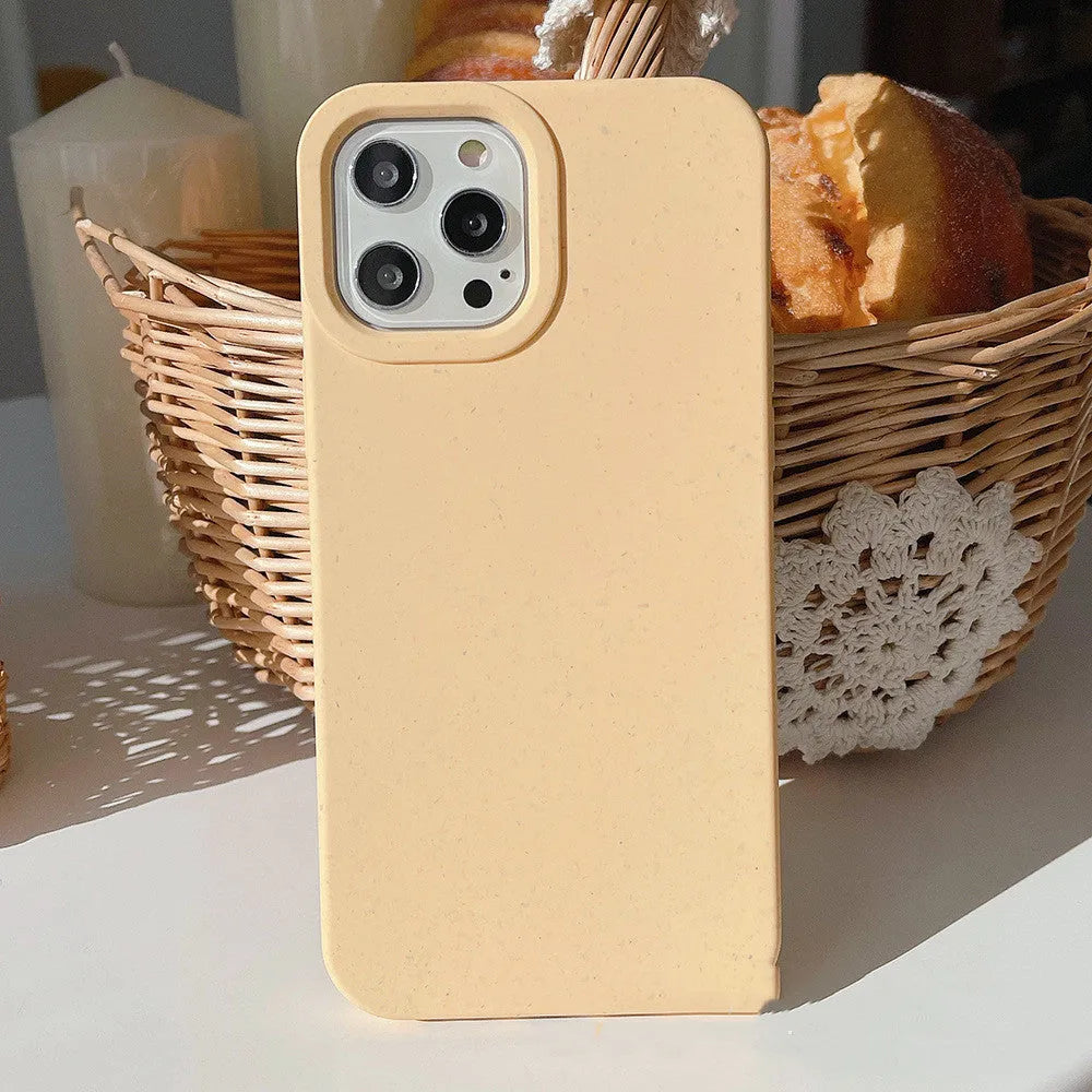 Wheat straw fibre degradable rear cover case for Apple iPhone on a table.