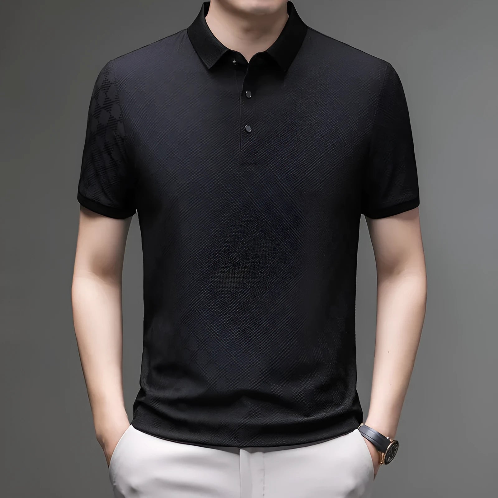 Man wearing a black rhombus-patterned short sleeve T-shirt with a slit detail.