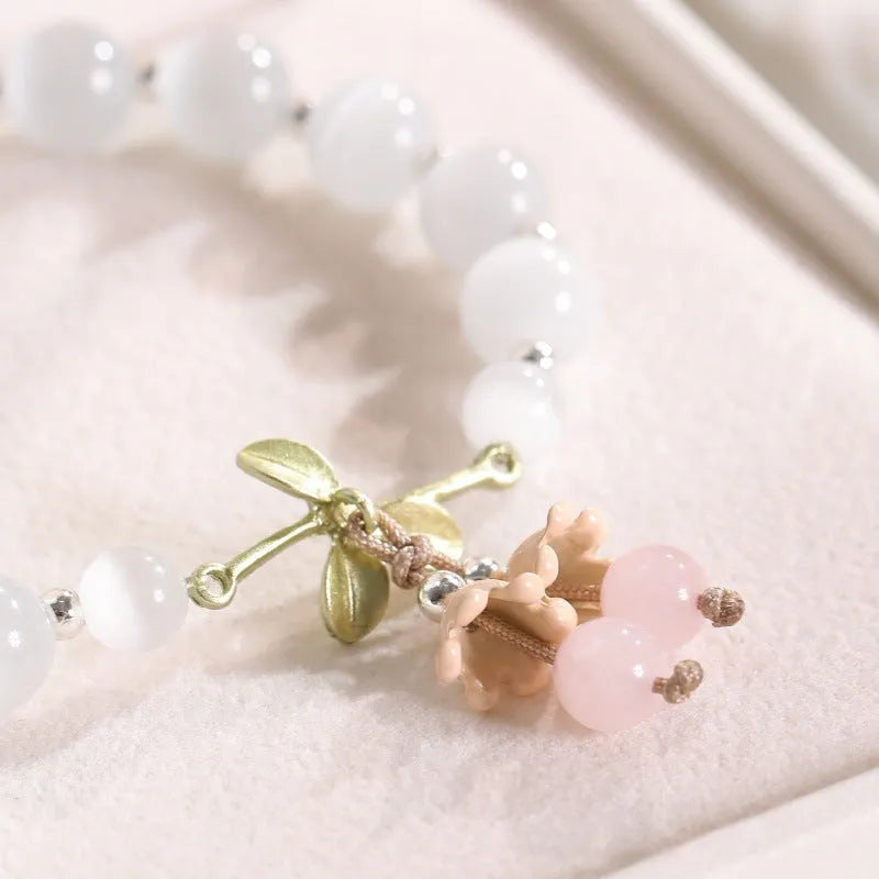 Women's cat's eye stone beaded bracelet with electroplated opal stones in diamond shape.