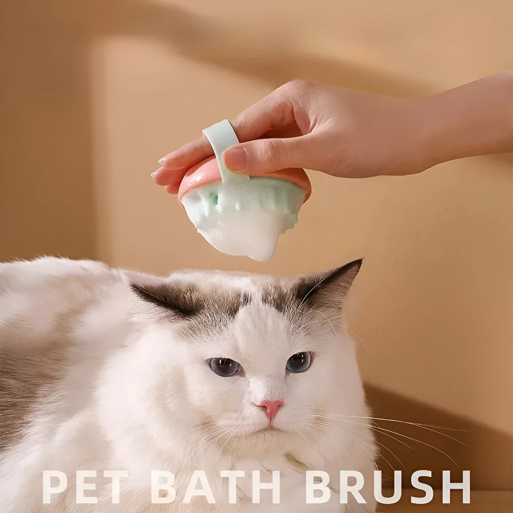 Blue silicone pet bathing brush with soft bristles and ergonomic handle for cats and dogs.