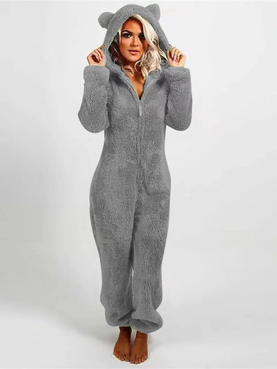 Fleece-lined thickened furry hooded jumpsuit pajama with zipper, loose fit, warm red colour lounging on bed