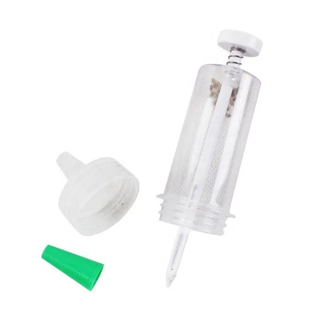 Compact 12 cm long plastic mini planter tool for sowing seeds in pots and trays.